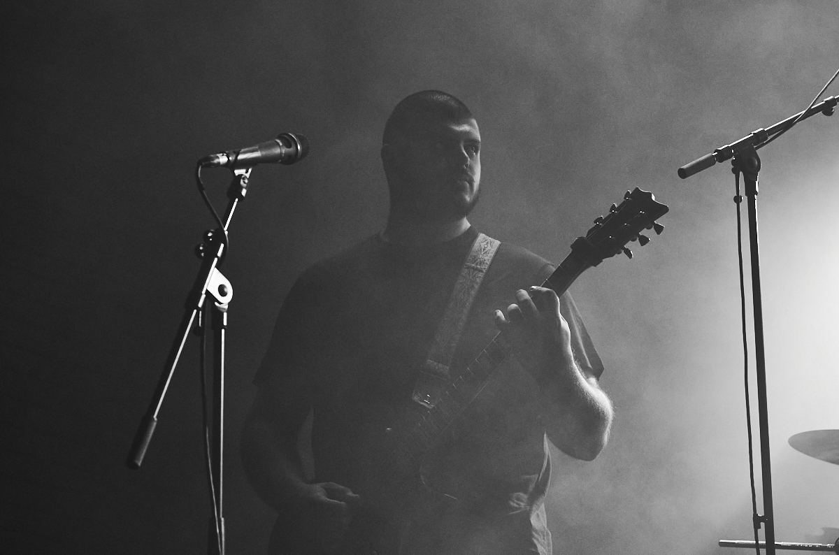 Guitarist of the band Kevel performing live at Temple Athens