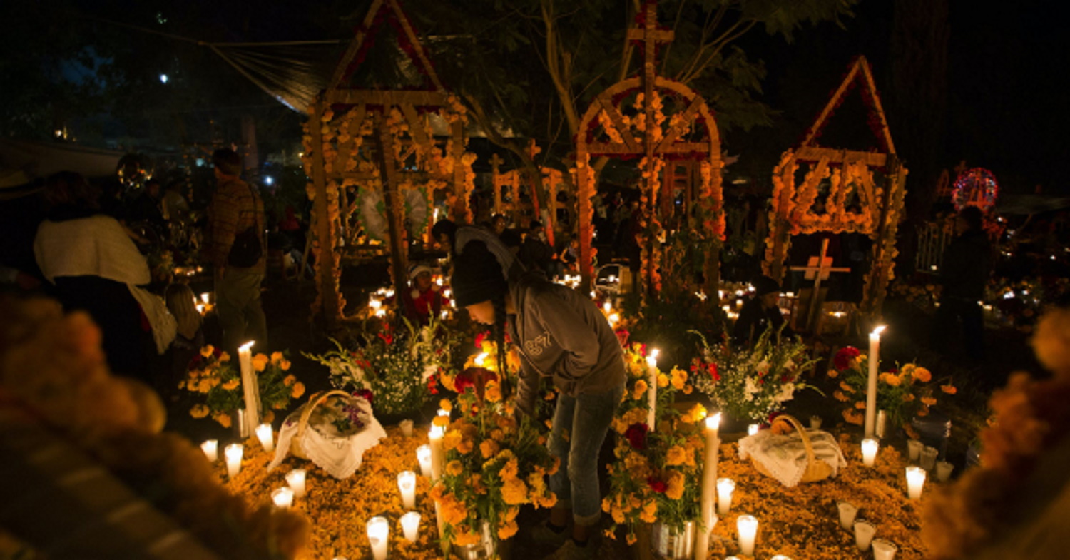 A large Dia de los Muertos candle altar, dedicated to the dead