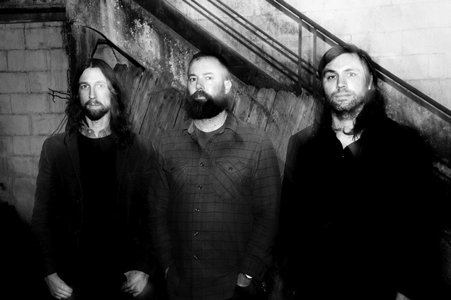 Mike Sullivan (left), Brian Cook (middle), and Dave Turncrantz (right) of the Russian Circles, posing for a photoshoot