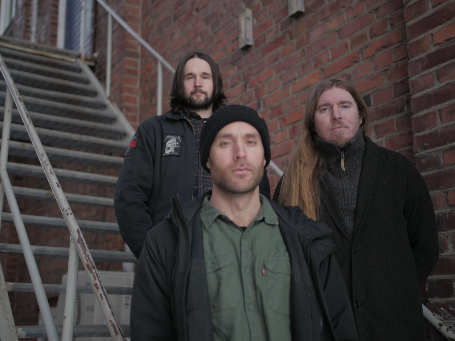 Swedish fuzz rock band Maha Sohona members posing for a photoshoot